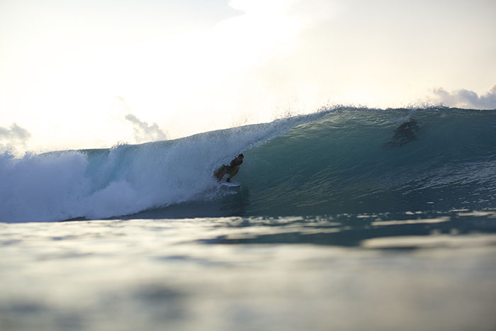 Left hander wave. Surfer in Mentawai Resort